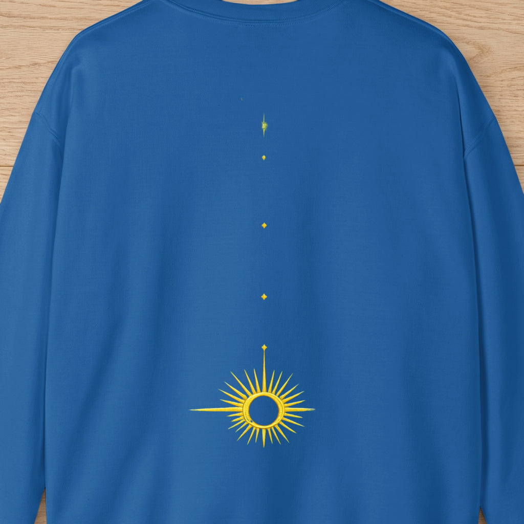Blue sweatshirt with a yellow sunburst graphic and scattered dots.
