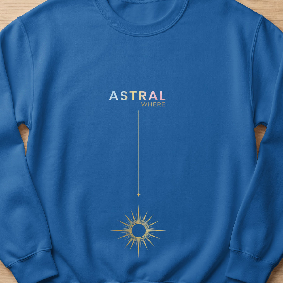 Blue sweatshirt with gold sun graphic and "ASTRAL WHERE" text.