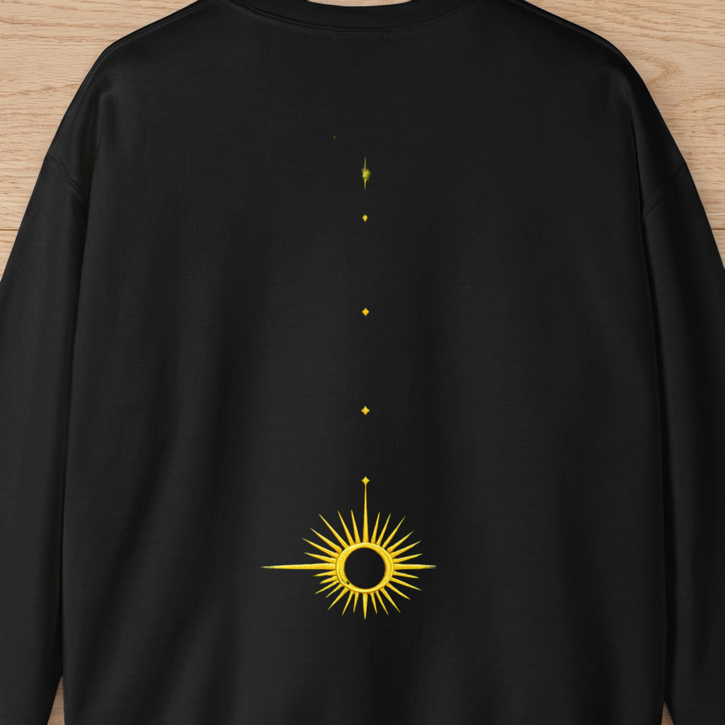 Black sweatshirt with a yellow sun design and scattered diamond shapes above.