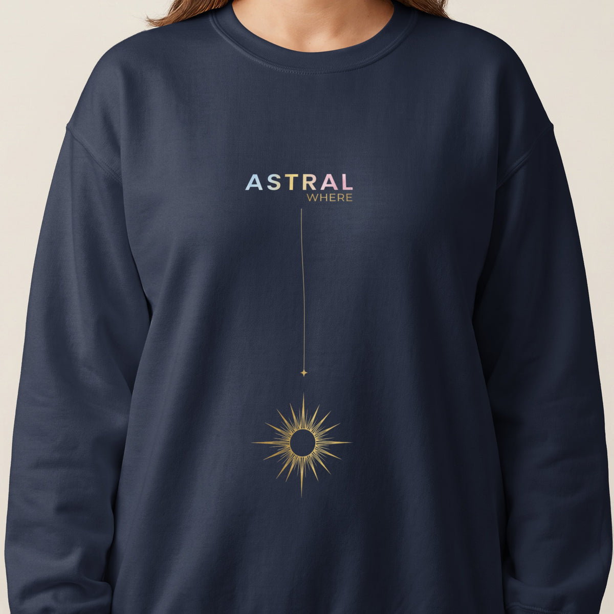 Navy sweatshirt with "ASTRAL WHERE" text and golden celestial sun graphic.