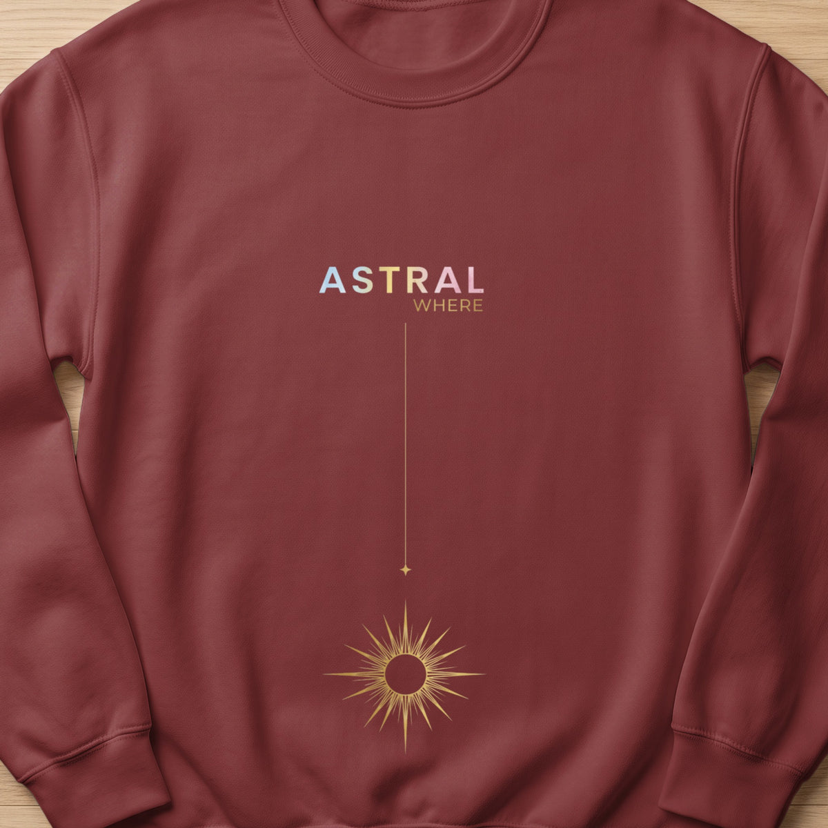 Maroon sweatshirt with "ASTRAL WHERE" text and a sun graphic.